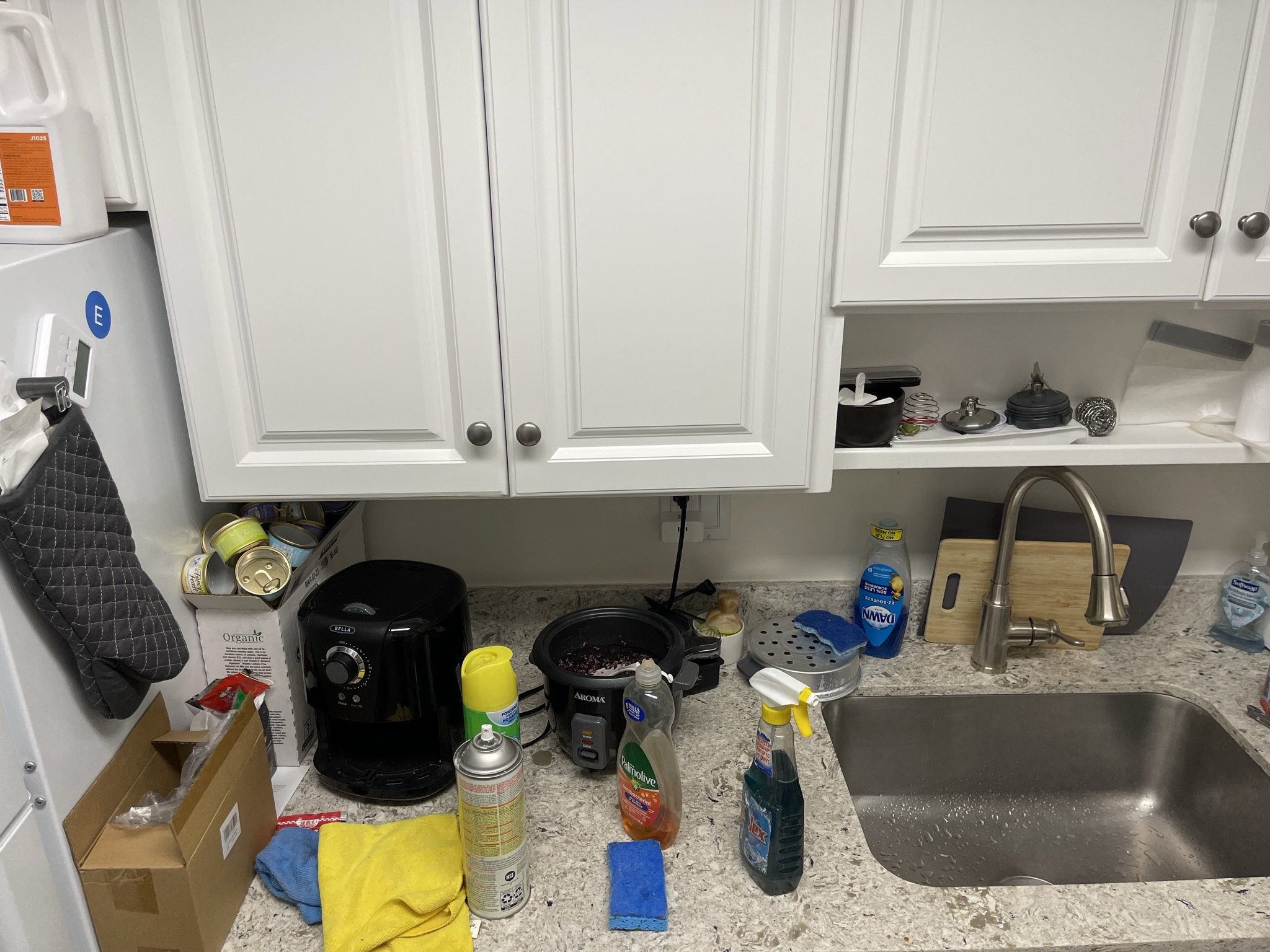 Kitchen stove cleaning in progress